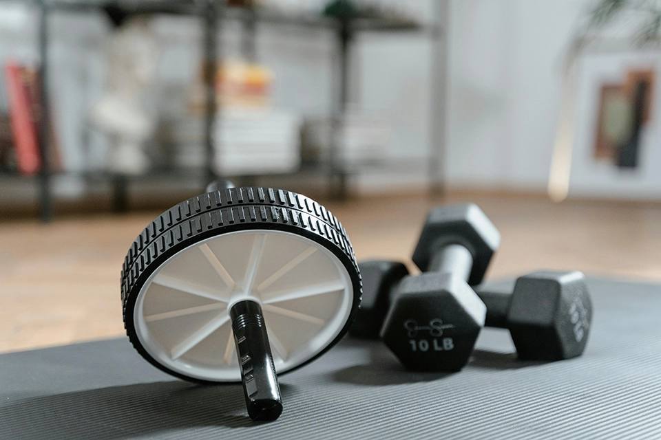 Close-up shot of 10 lb dumbbells and roller